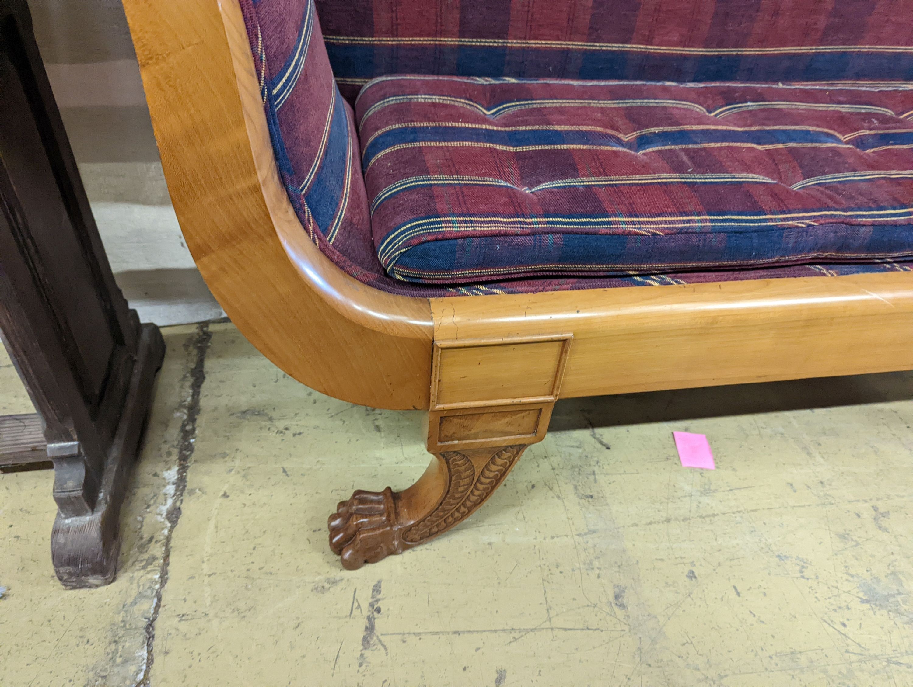 A Biedermier style cherry scroll arm settee with buttoned squab cushion on carved claw feet, length 200cm, depth 51cm, height 97cm